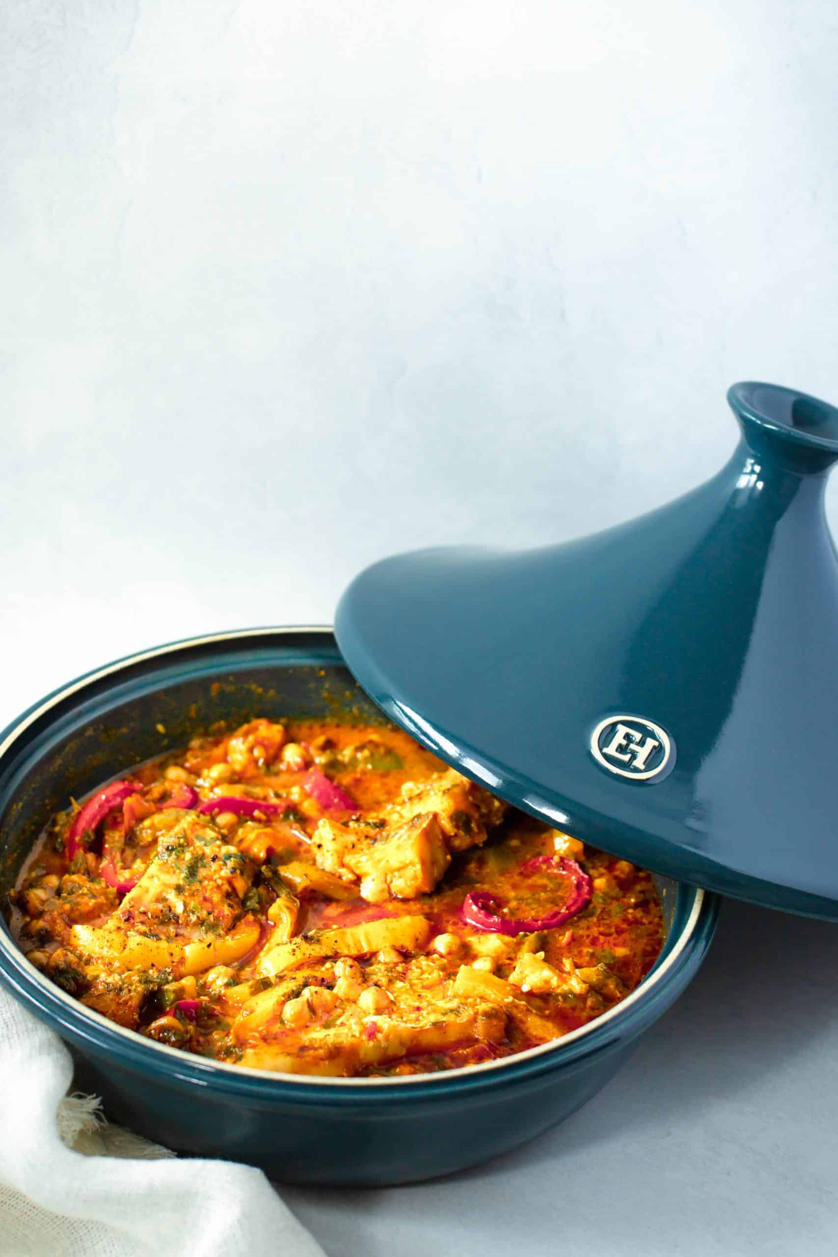 braised fish in a blue tagine pot with lid