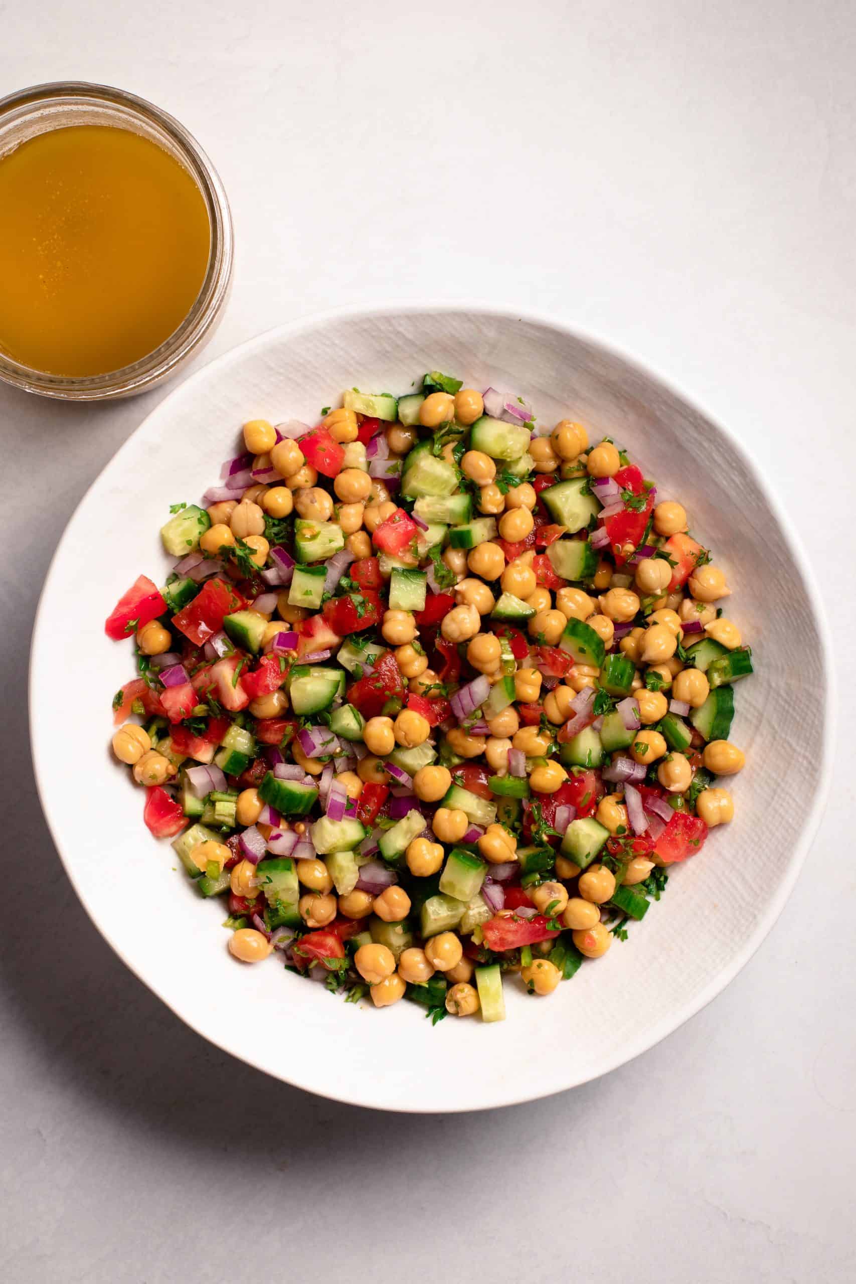 A white bowl chickpea salad