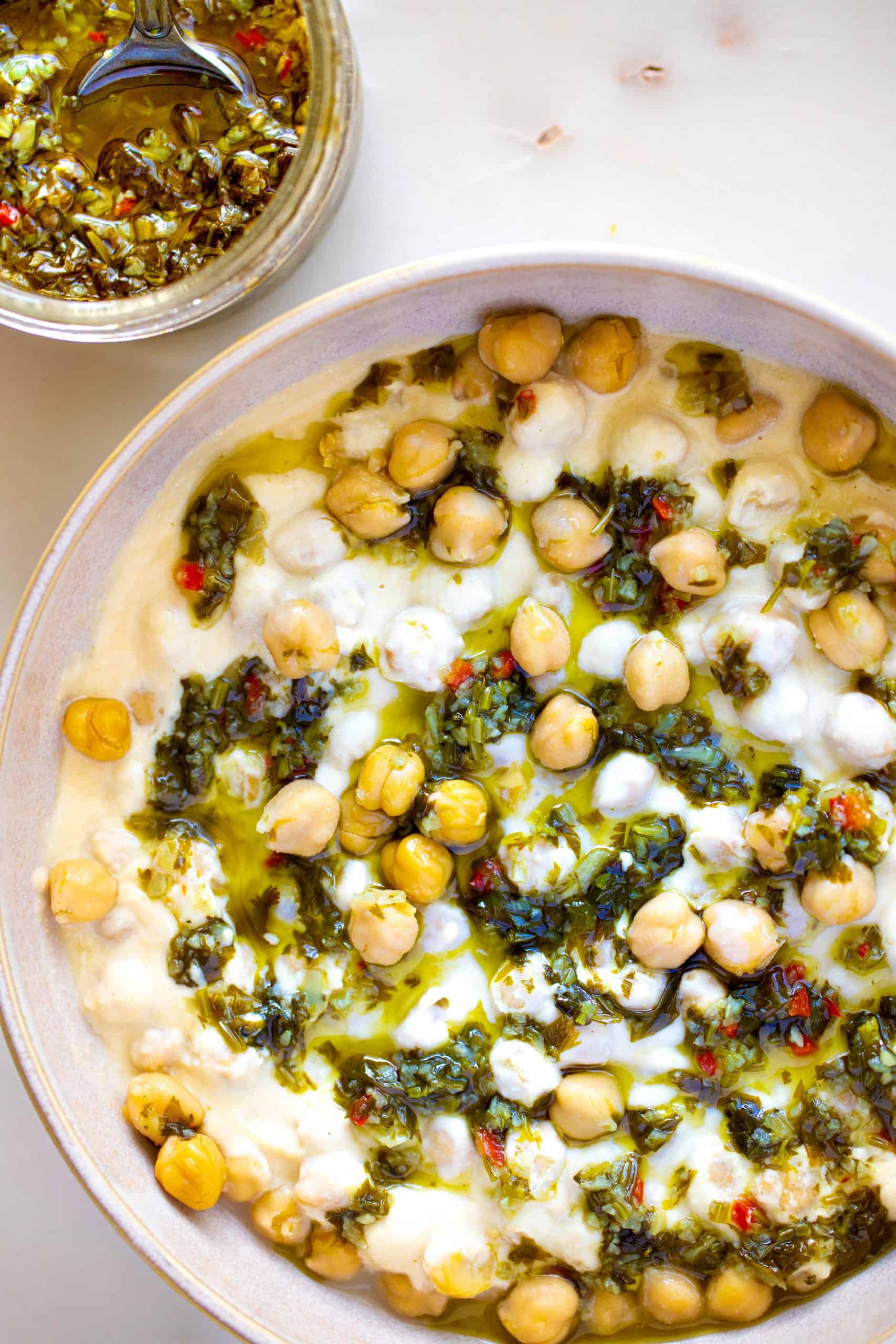 chickpea covered in hummus top with garlic herb pesto