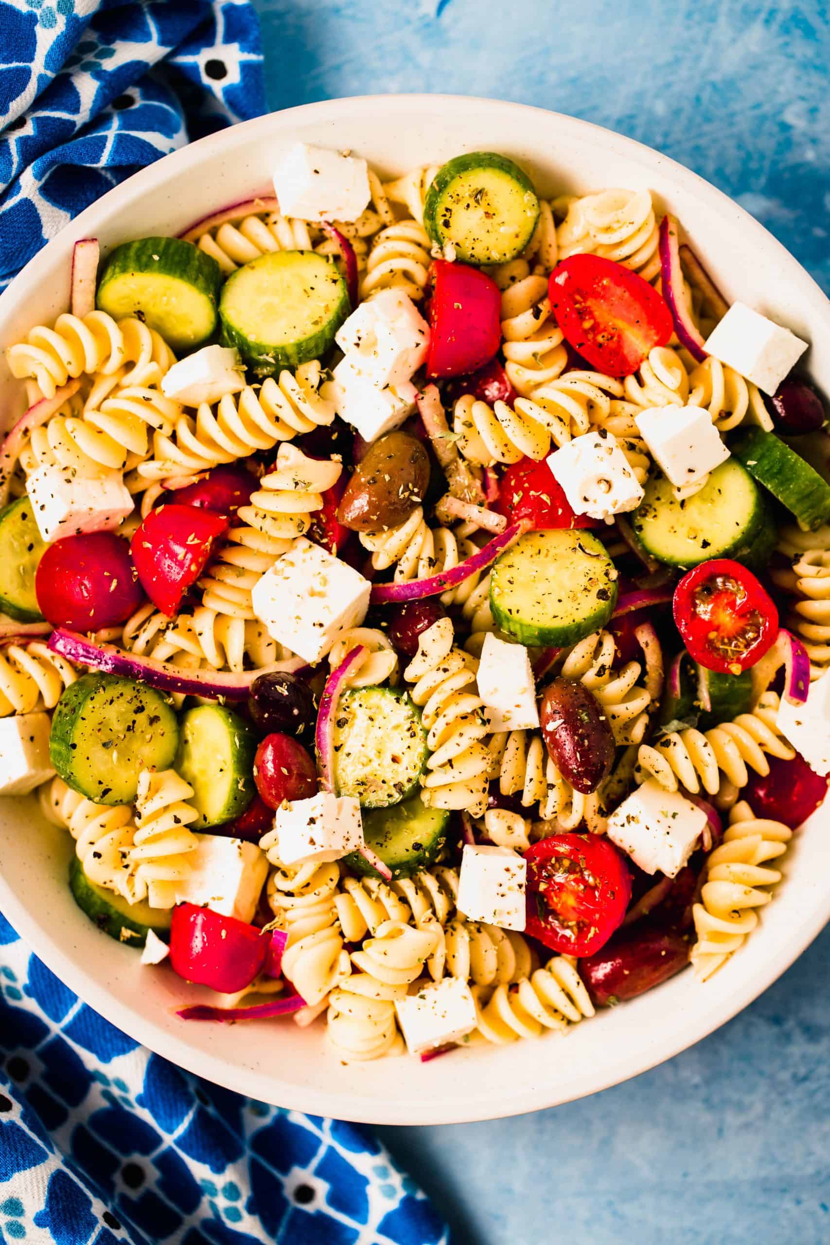 white bowl filled with greek pasta salad