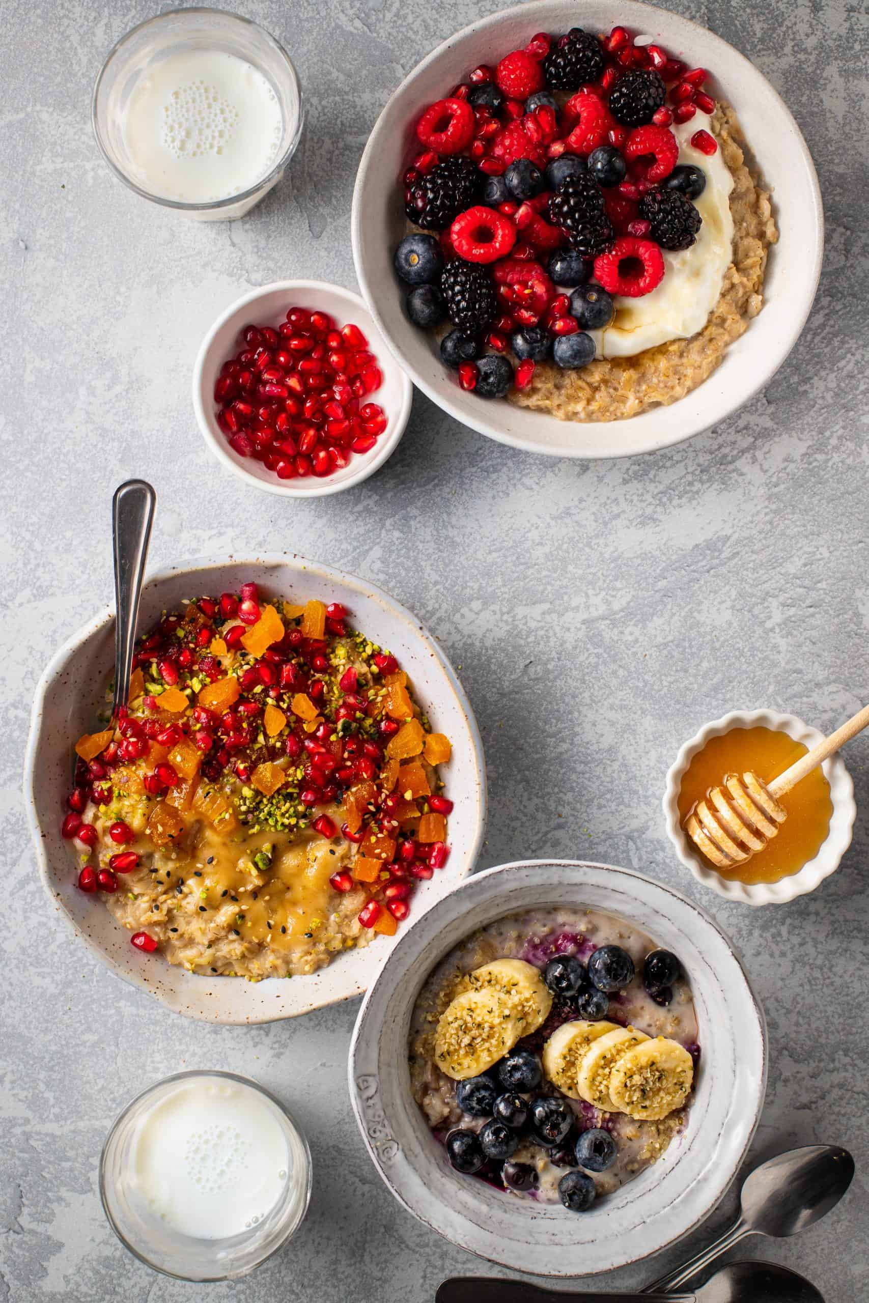 Three bowls of Oatmeal with various toppings