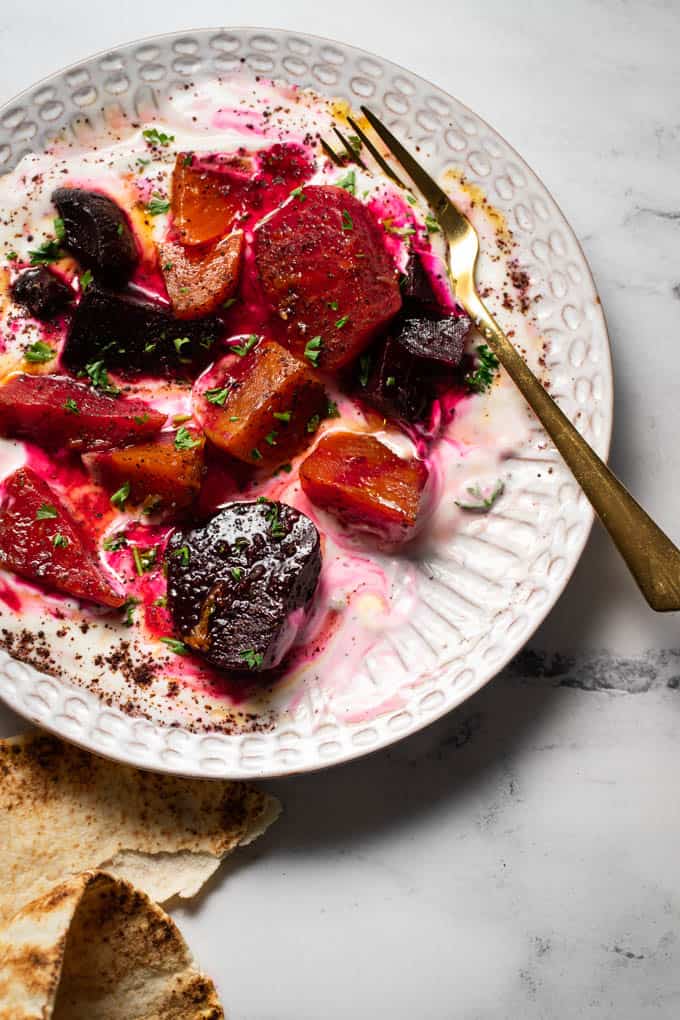 A textured plate with Strained yogurt roasted beet and dressing