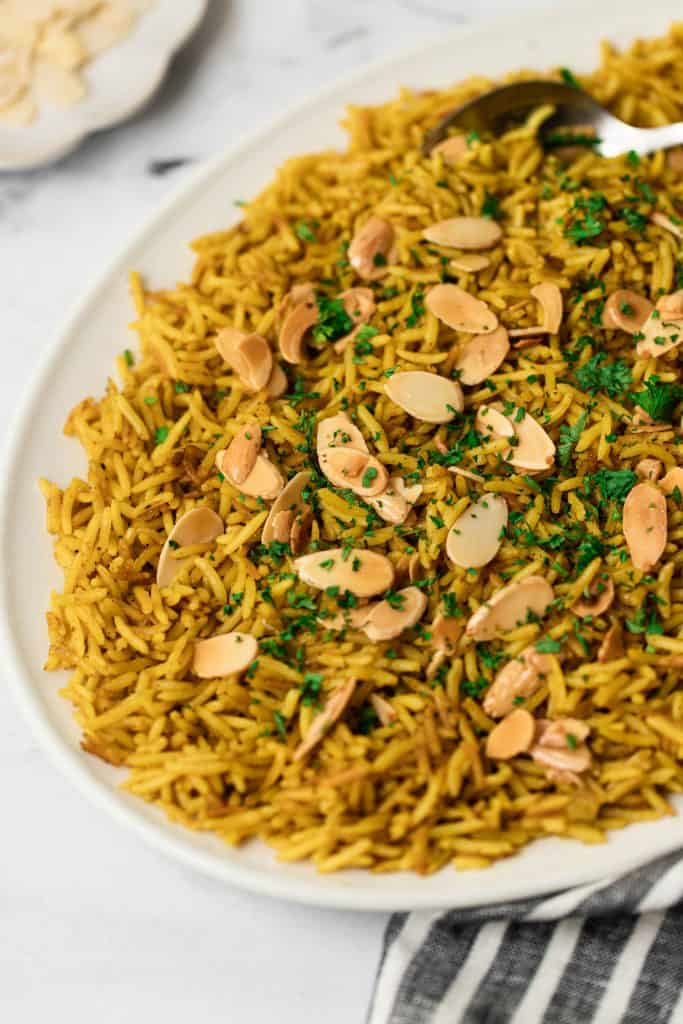 Mediterranean Yellow rice topped with almonds and parsley