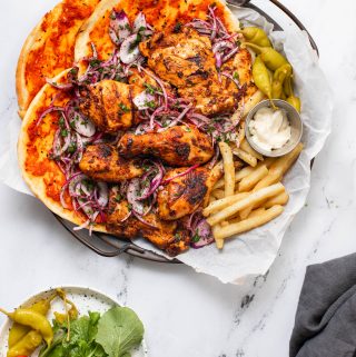 BBQ chicken and Flatbread platter with french fries and pickled peppers